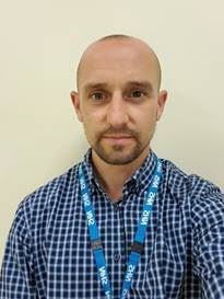 A picture containing person, person, wall, indoor

Description automatically generated